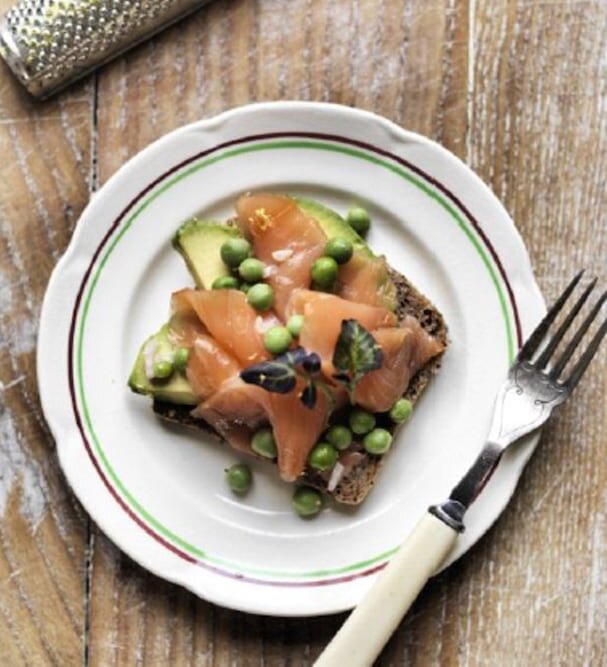 Norwegian smoked salmon on rye with avocado & peas