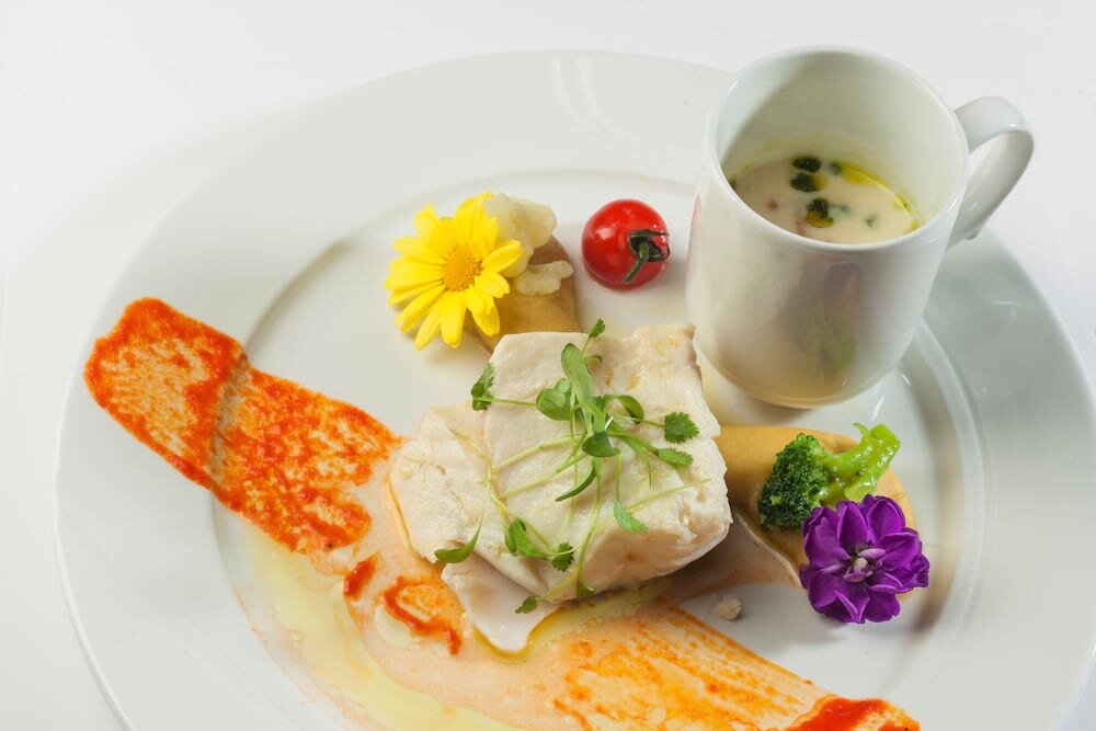 Confit fillet of Norwegian SKREI® with and mashed garbanzo beans and seasonal vegetables