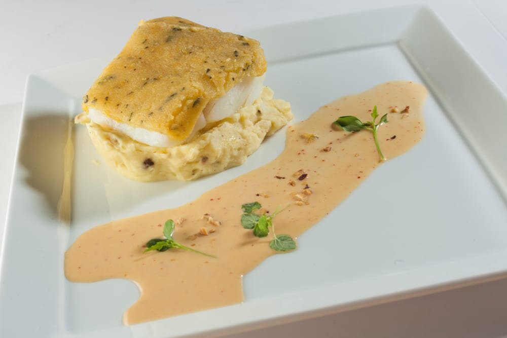 Fillet of Norwegian SKREI® with a Bergamot Orange and Sage Crust served on mashed “ratte du Touquet” potatoes with Hint of Hazelnut