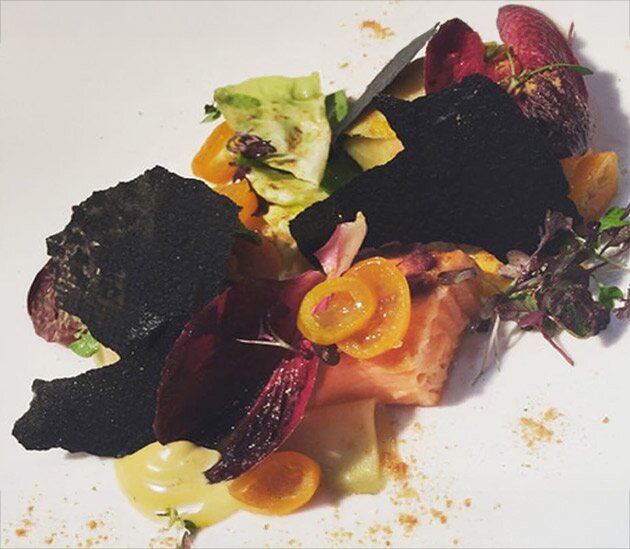 Roasted Norwegian Fjord Trout, carrot and preserved kumquat salad and squid ink crackers with liquorice