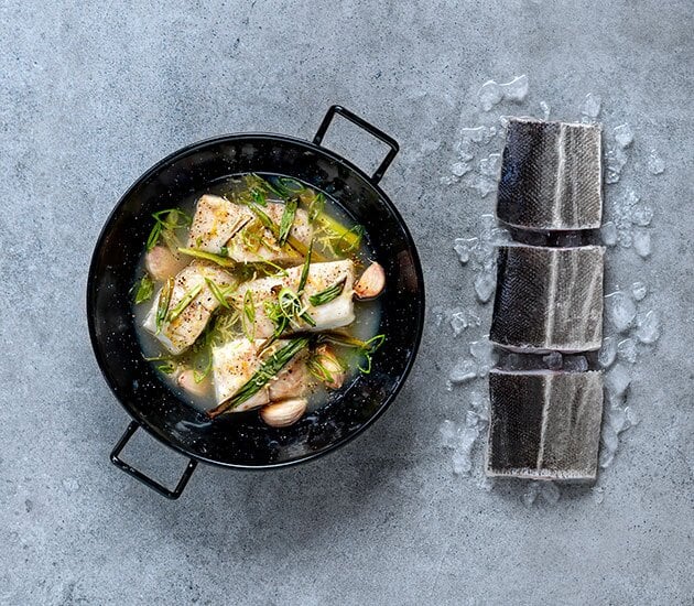 Oven-baked saithe in lemon and apple sauce