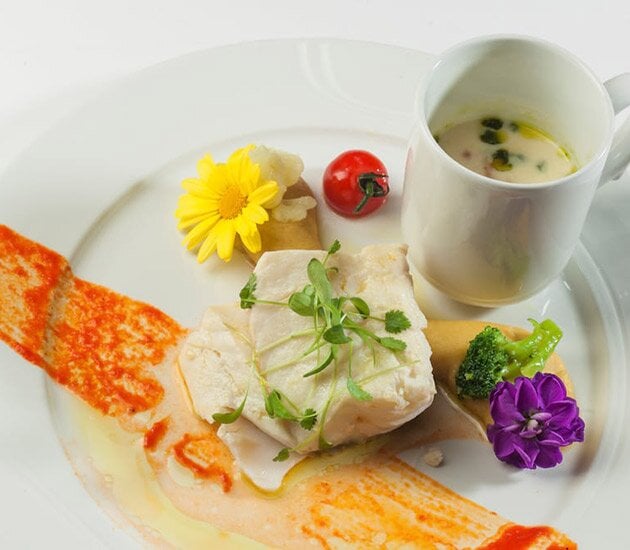 Confit fillet of Norwegian SKREI® with and mashed garbanzo beans and seasonal vegetables
