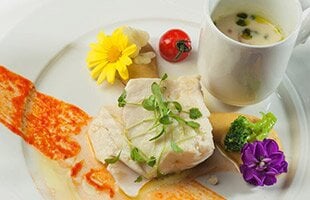 Confit fillet of Norwegian SKREI® with and mashed garbanzo beans and seasonal vegetables