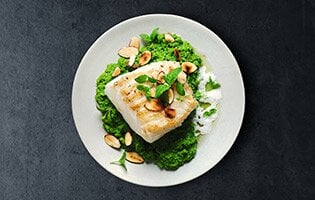 Grilled Skrei with Pea Purée, Mint Oil and Almond Foam