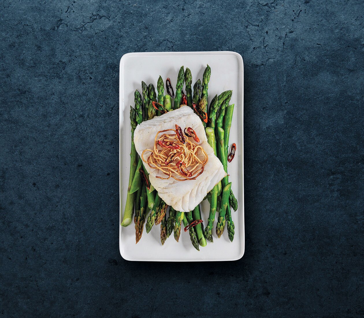 Norwegian Skrei on a bed of asparagus