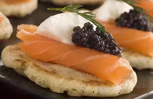 Norwegian smoked salmon blinis with crème fraiche and caviar  
